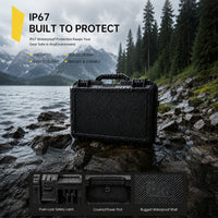 Black waterproof case on a rocky shore with mountain and forest background, emphasizing IP67 protection.