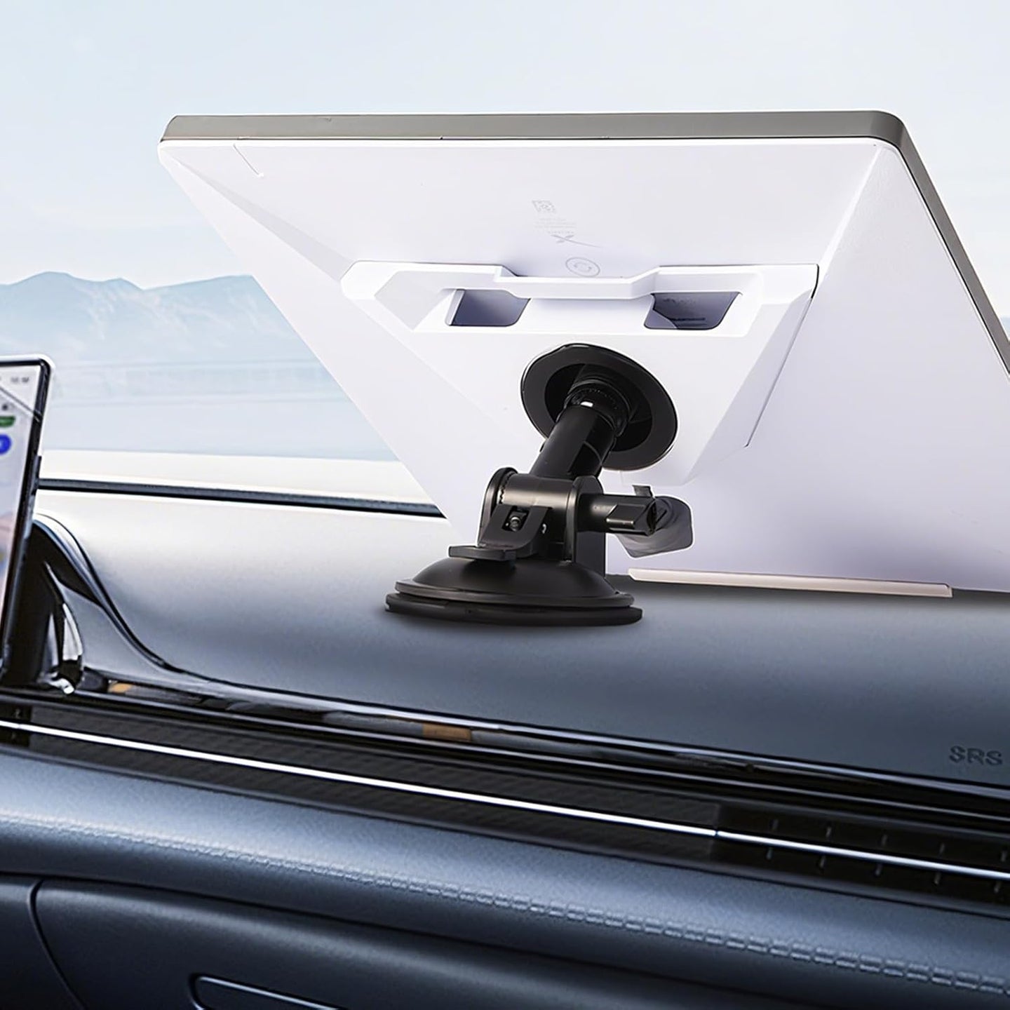 Starlink Mini windshield suction cup mount base installed on a vehicle dashboard